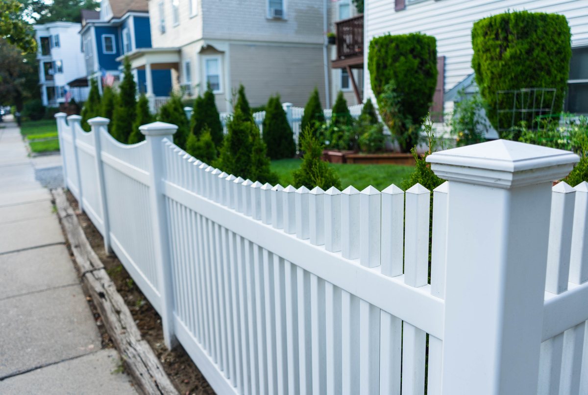 White picket fence in front of a home