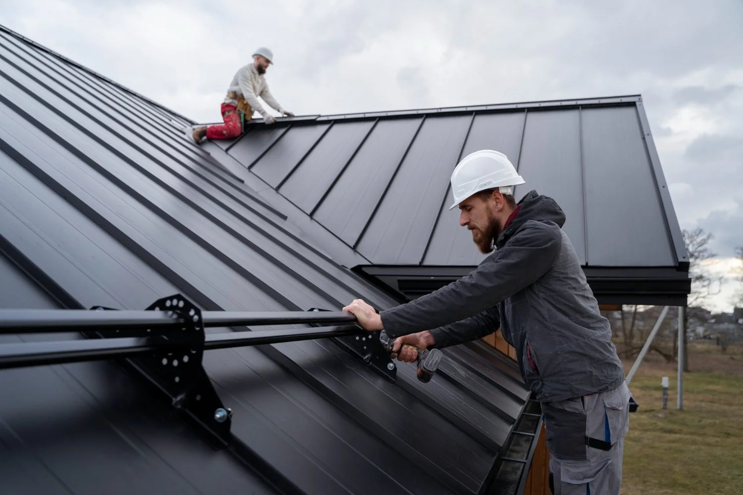 Pacific crew installing a standing-seam metal roof